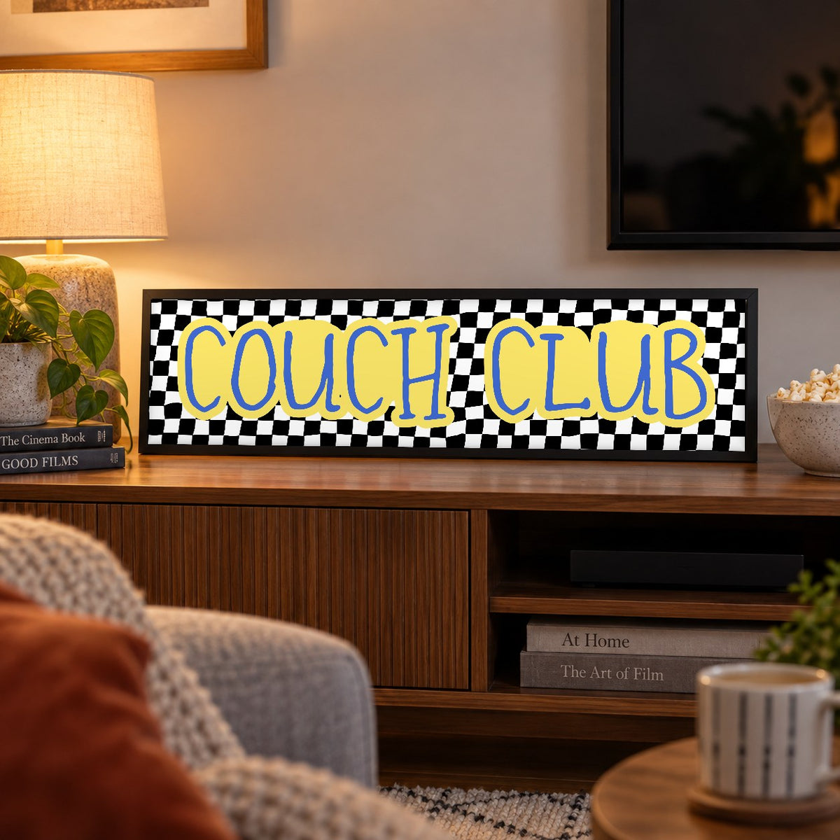 Couch Club panoramic print in a black frame in a room setting