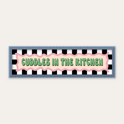 Cuddles In The Kitchen panoramic print in a blue bobbin frame