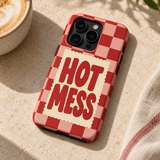 Hot Mess Original Protective Case, matte, on iPhone 15 Pro in an illustrative lifestyle setting.