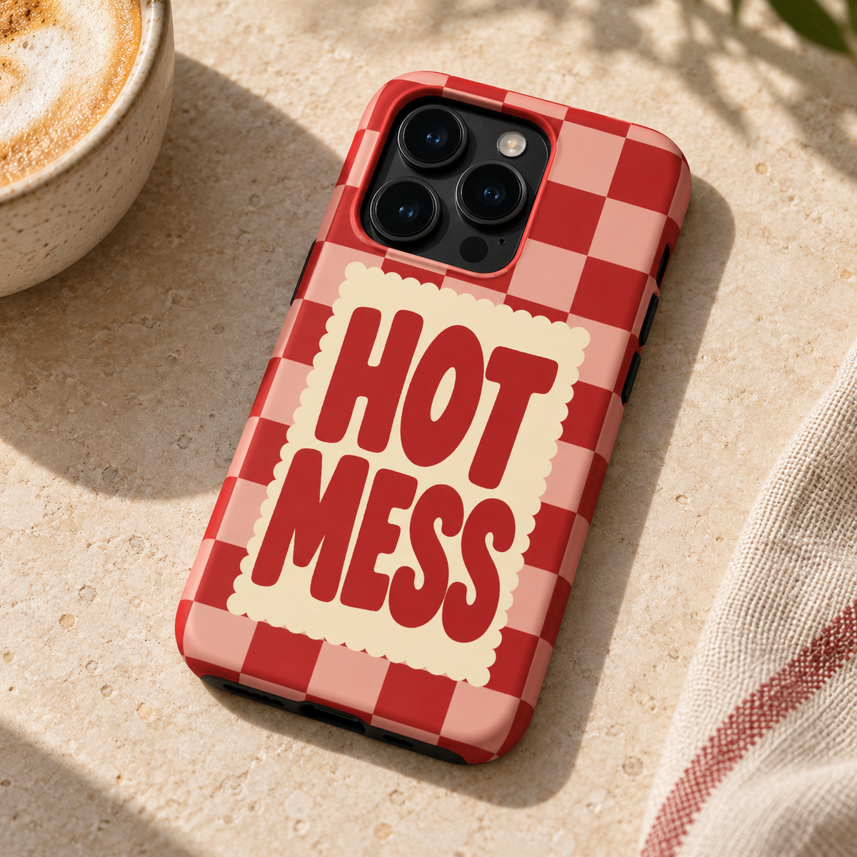 Hot Mess Original Protective Case, matte, on iPhone 15 Pro in an illustrative lifestyle setting.