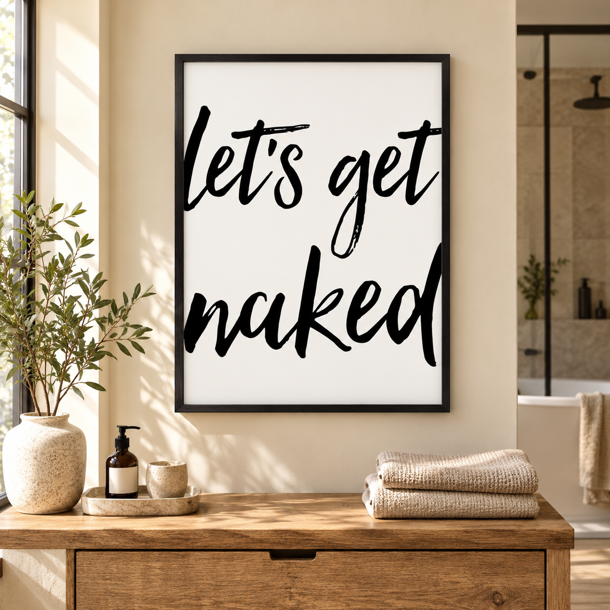 Lets Get Naked Print — wider room setting, black oak frame