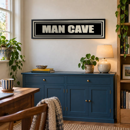 Man Cave panoramic print in a black frame in a room setting