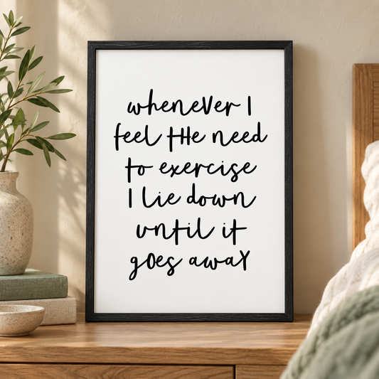 Whenever I Feel The Need To Exercise I Lie Down Until It Goes Away Print — close lifestyle view, black oak frame